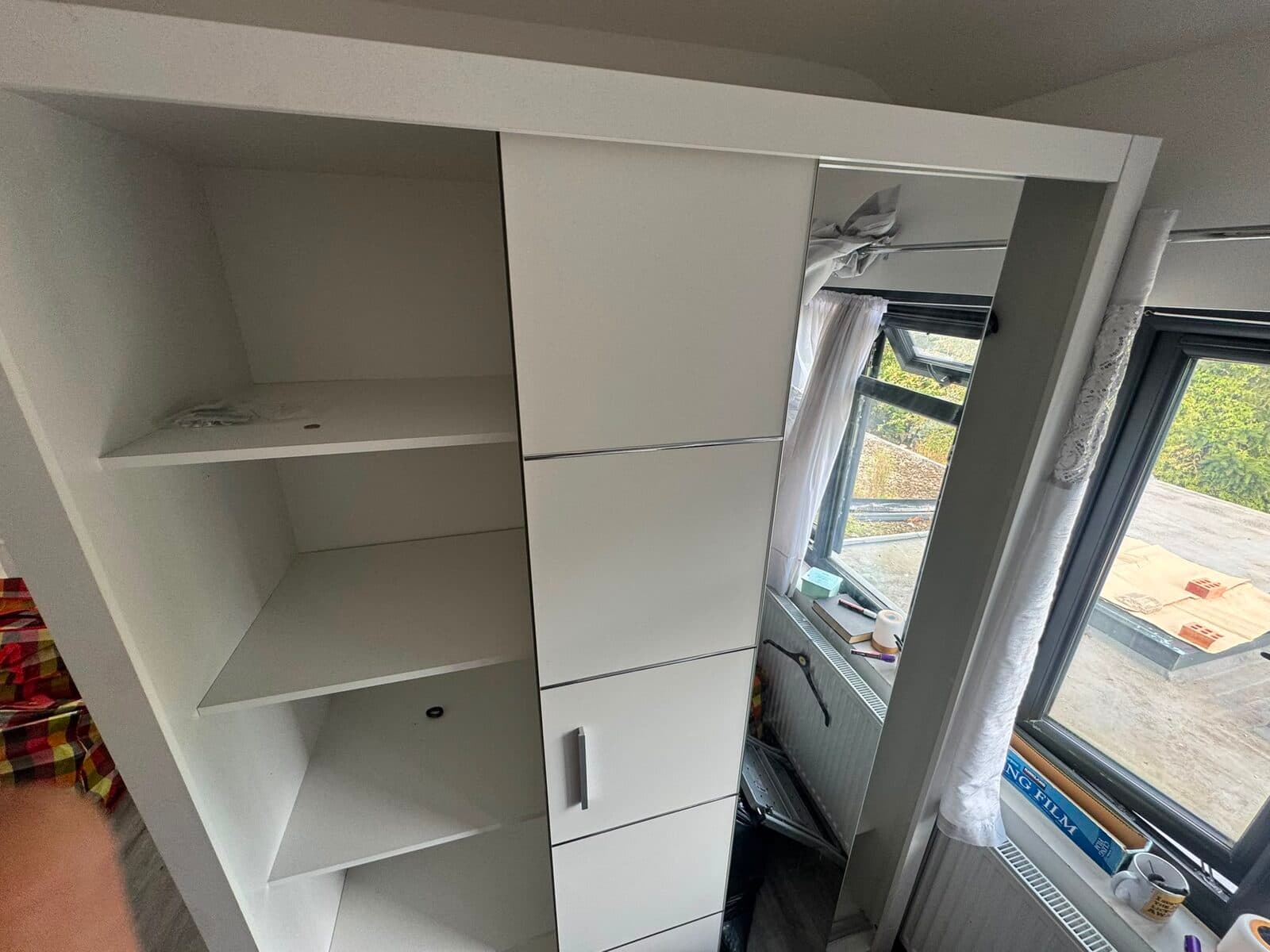 Mirrored sliding-door wardrobe dismantled by the RayMovals crew during the Uxbridge house removal