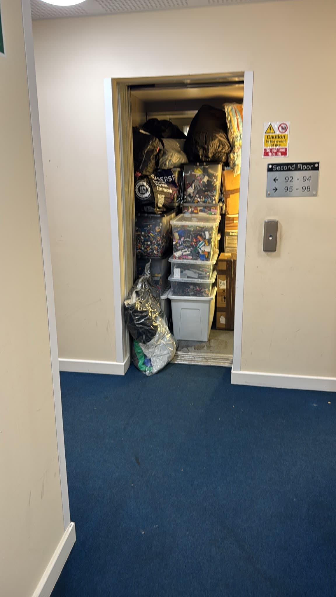 Lift loaded with storage boxes on the second floor during the Stevenage apartment move