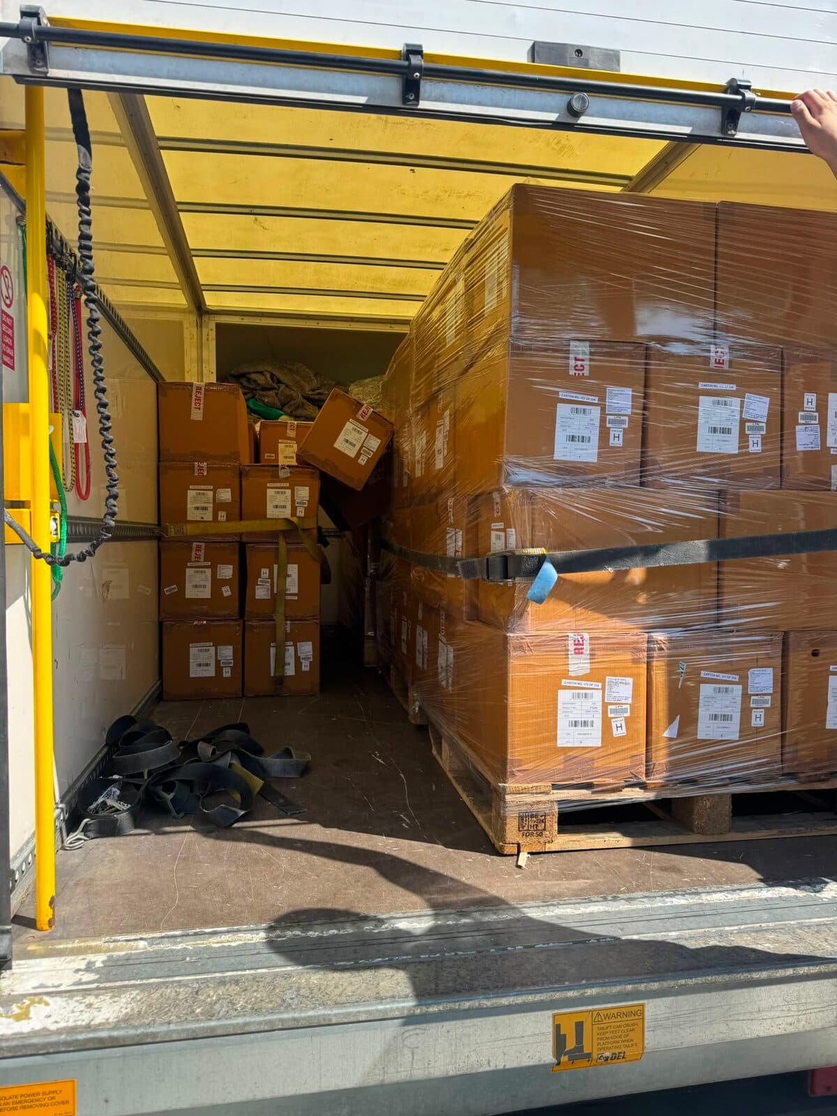 Pallets of business stock staged for loading in Milton Keynes
