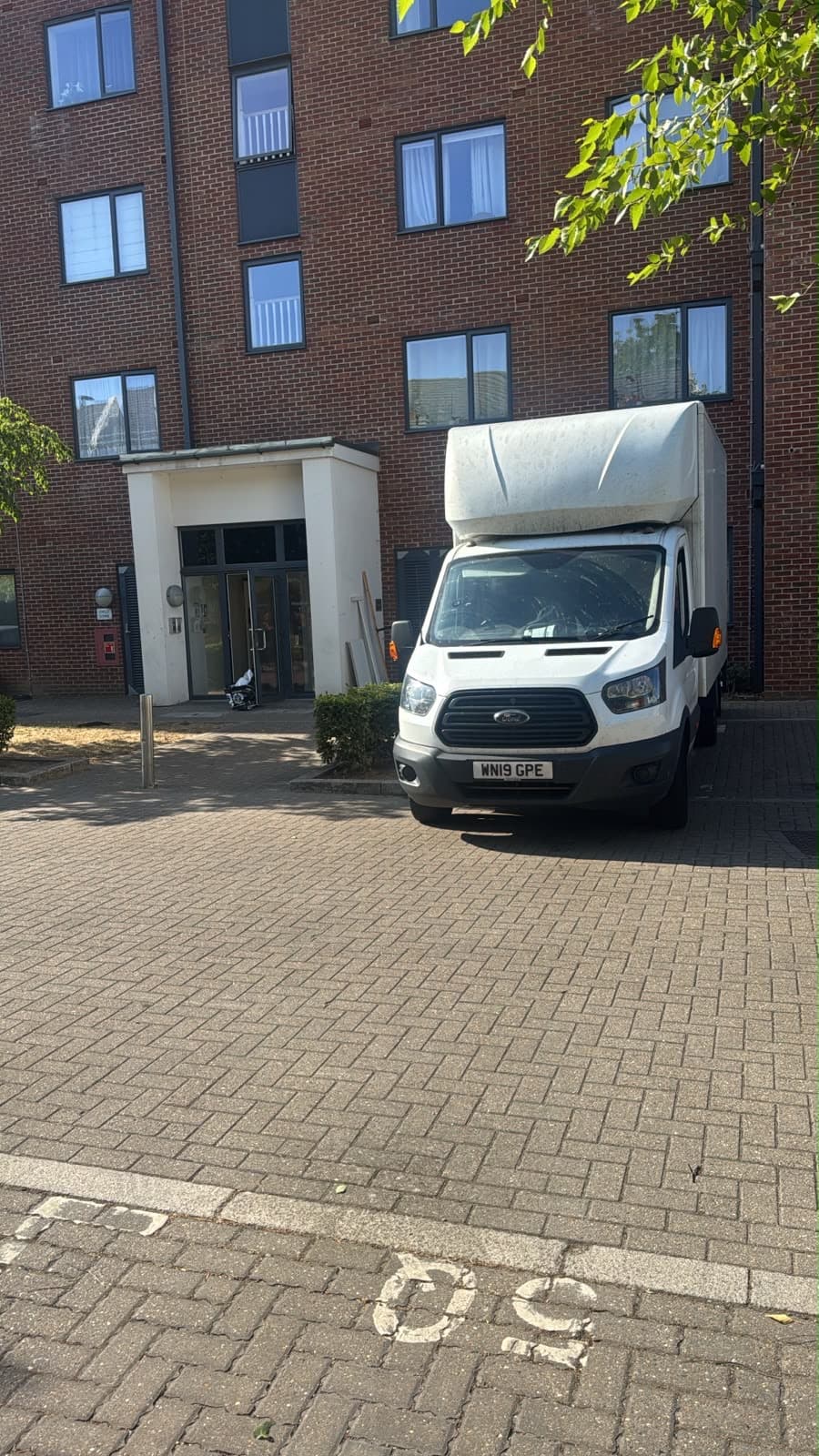 RayMovals Luton van outside apartment block in Harrow for a third-floor flat removal