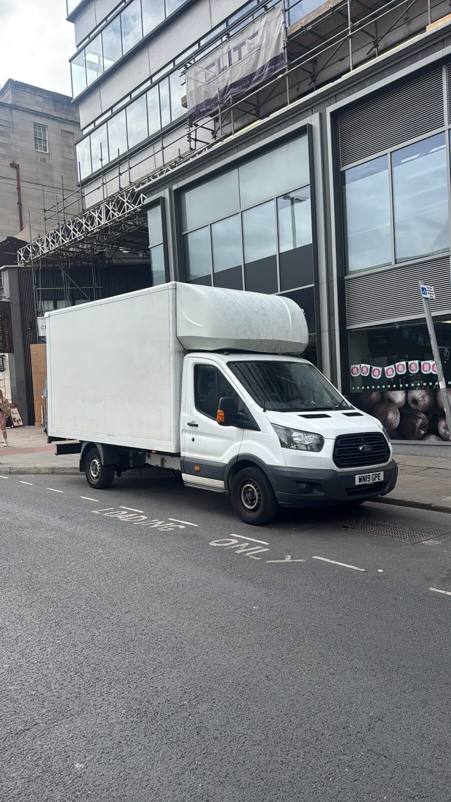 Luton van positioned on the loading side of the building for the A6 Motors office installation