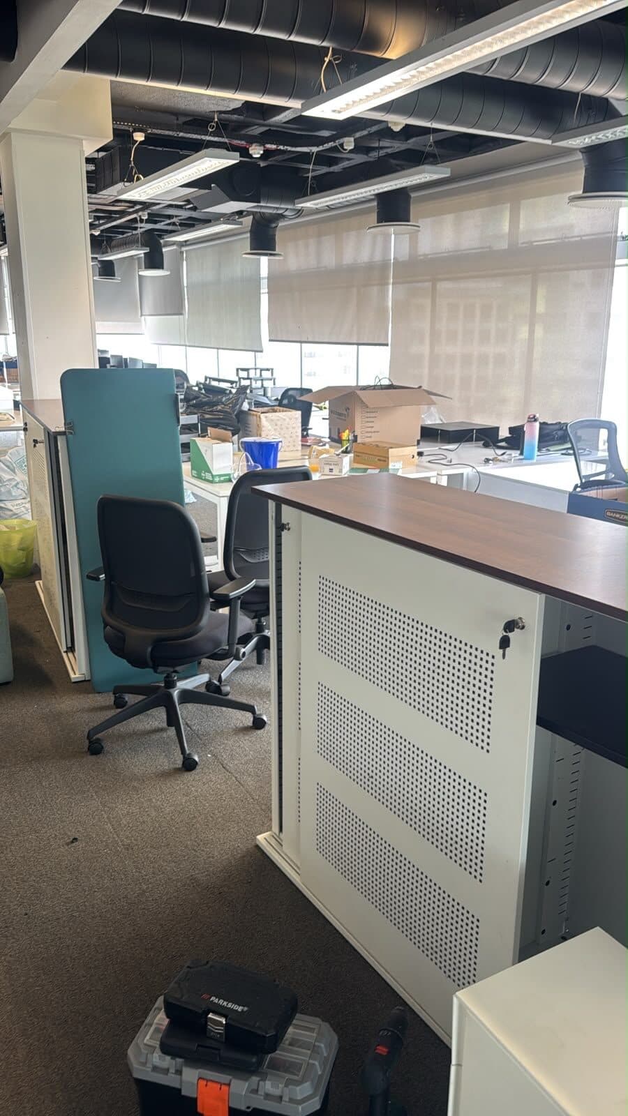 Office desks and pedestal units being assembled at the new A6 Motors office in Houghton Regis