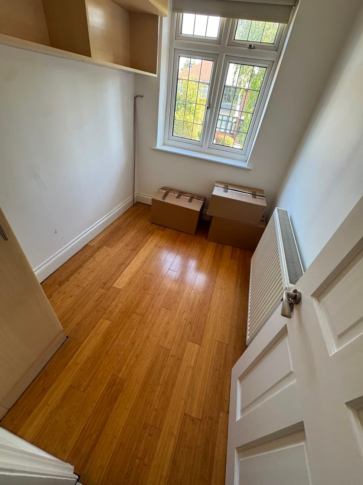 Bedroom cleared to bare floorboards after loading during the London to Richmond move