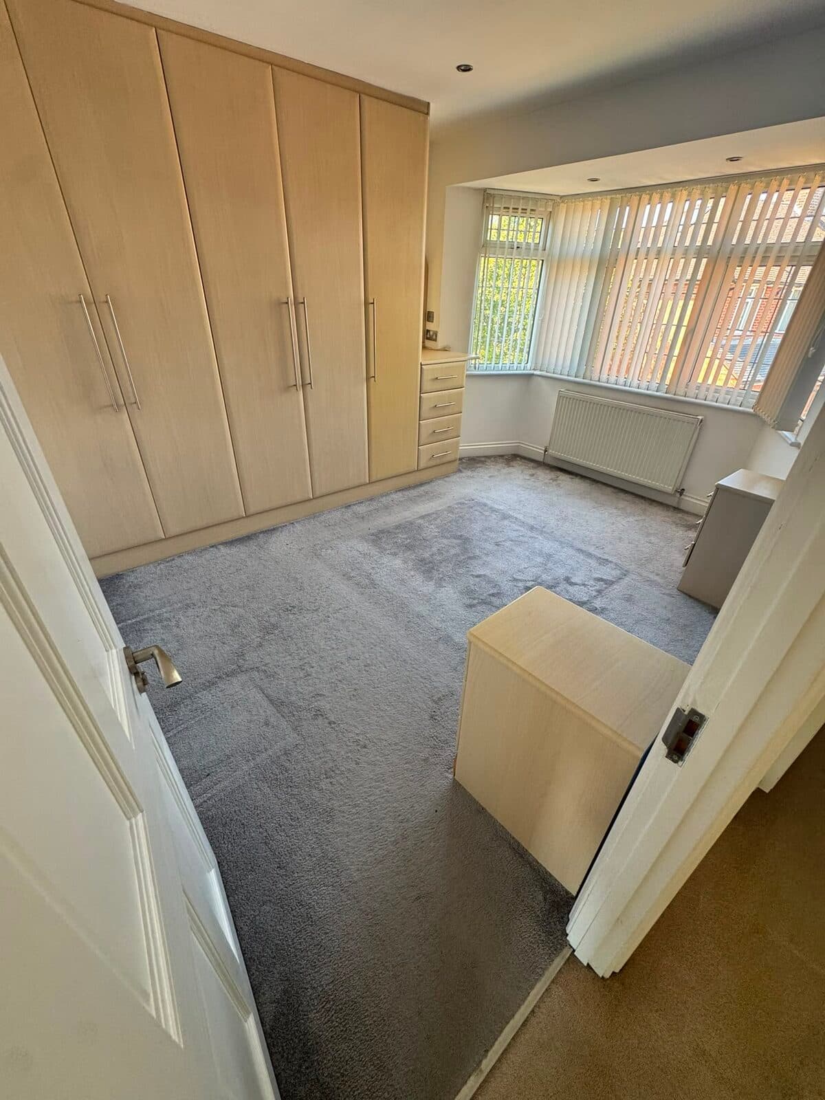 Fitted bedroom wardrobes emptied ahead of loading during the Harrow move
