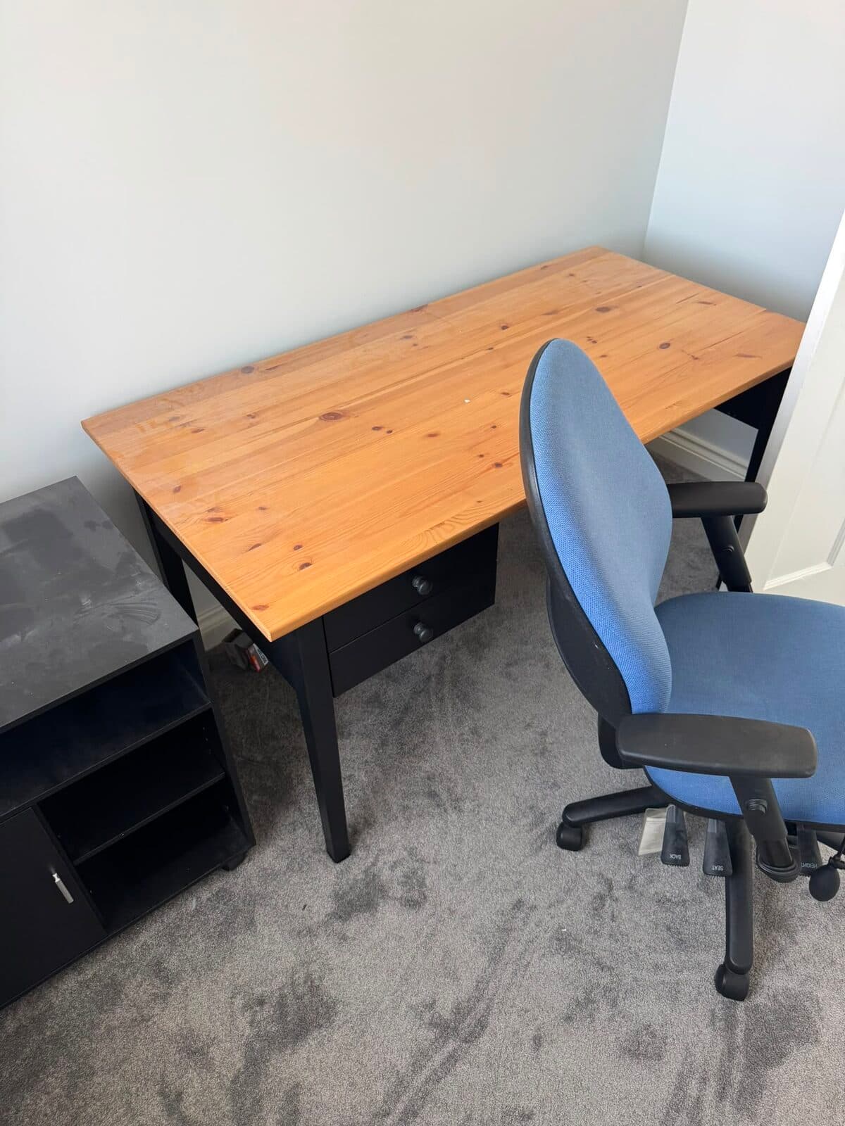 Desk and office chair set aside ready to load during the Luton house move