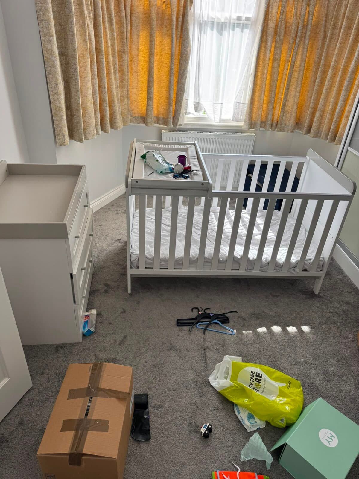 Nursery cleared and cot ready to be dismantled for the move across Luton