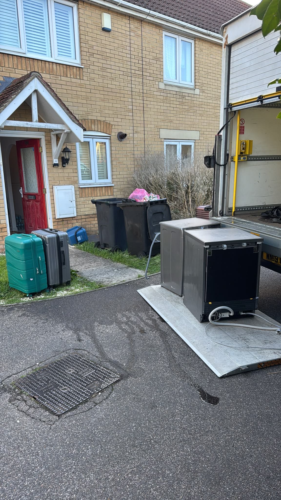 Washing machine and dishwasher disconnected and loaded onto the Luton van tail lift