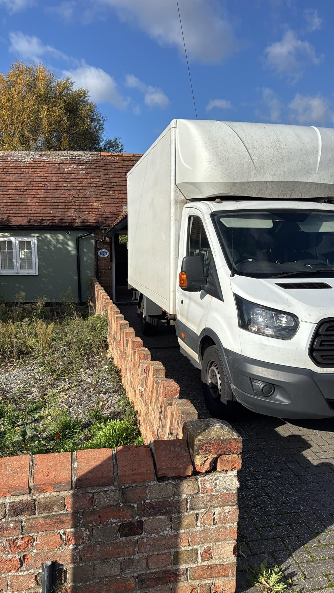RayMovals Luton van on the driveway of the bungalow in Bedford ready to unload