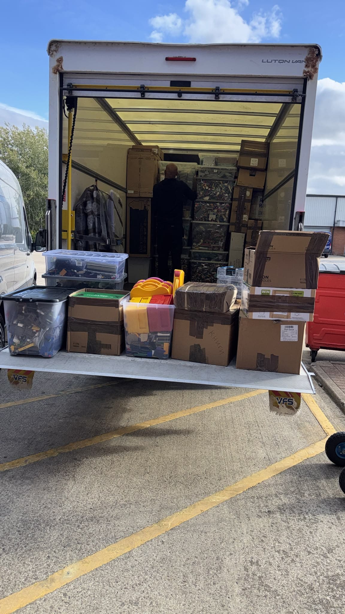 Boxes and storage crates loaded onto the Luton van tail lift during the Stevenage storage move