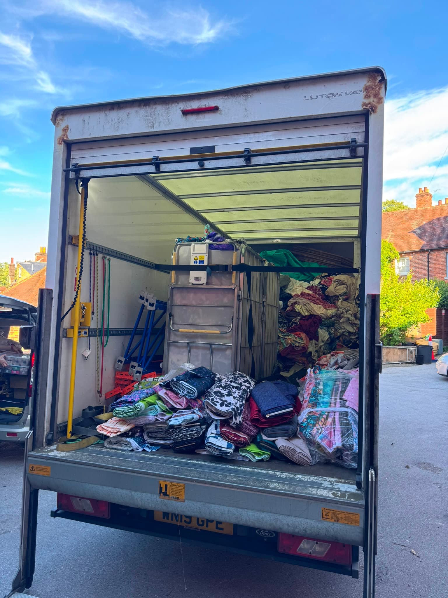 RayMovals Luton van with tail-lift down outside a period property during a house move