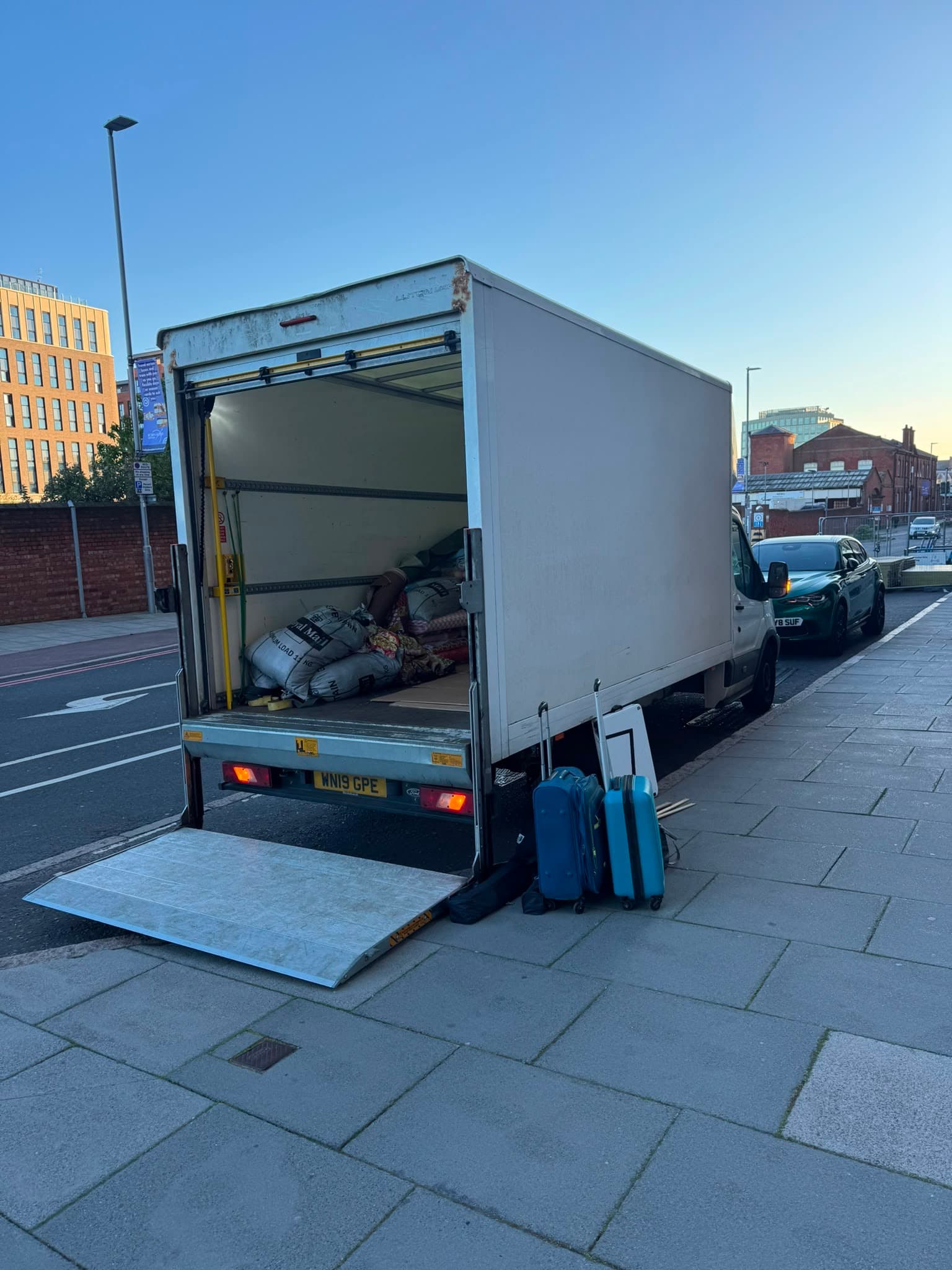 RayMovals removal van loaded with luggage at dusk, ready for a residential move
